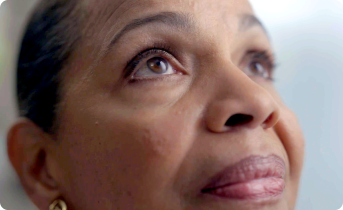 A woman in her 60s looking up