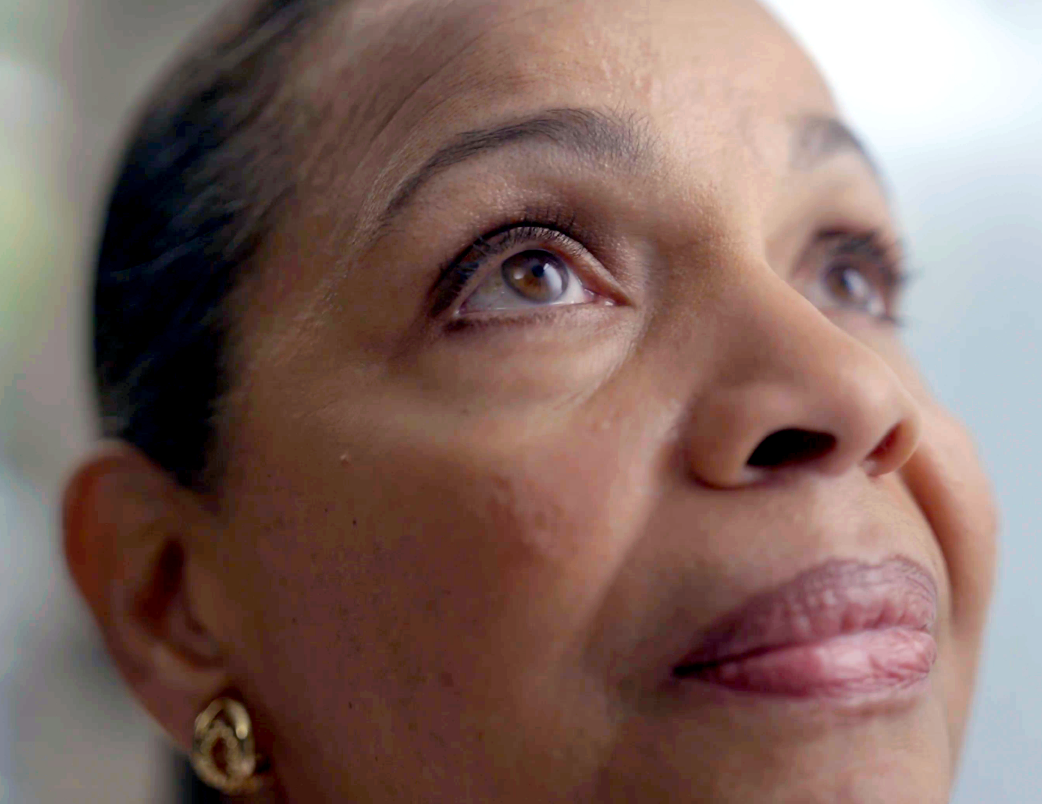 A woman in her 60s looking up