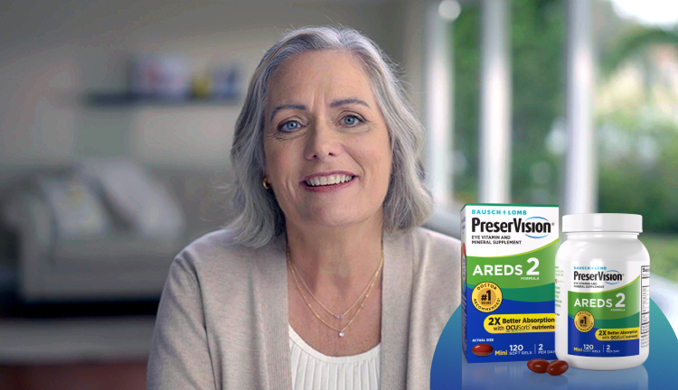 A woman in her 60s smiles and looks content and confident. A package and bottle of PreserVision Eye Vitamins sits next to her.

